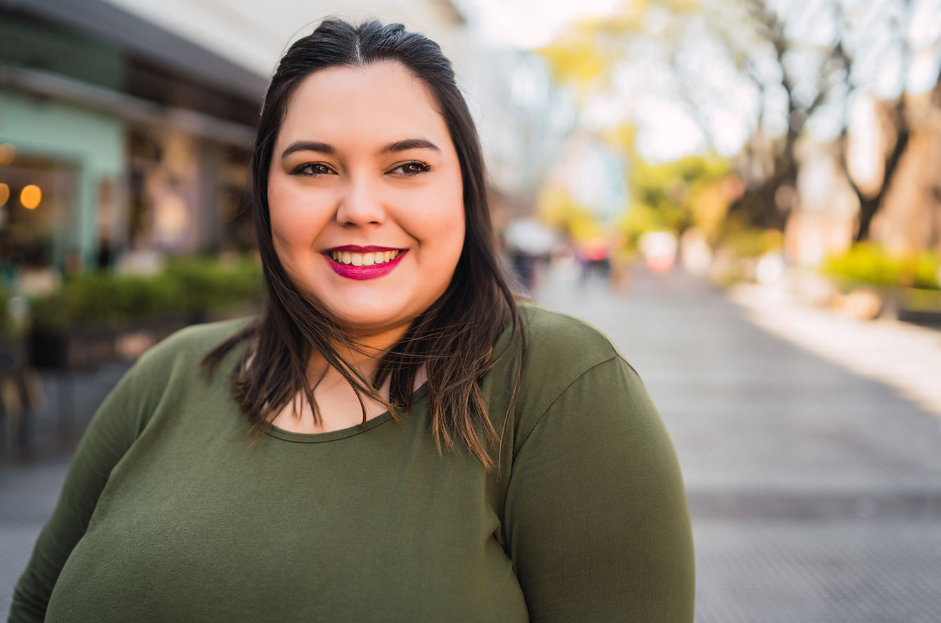 Portrait of young plus size woman with smooth skin