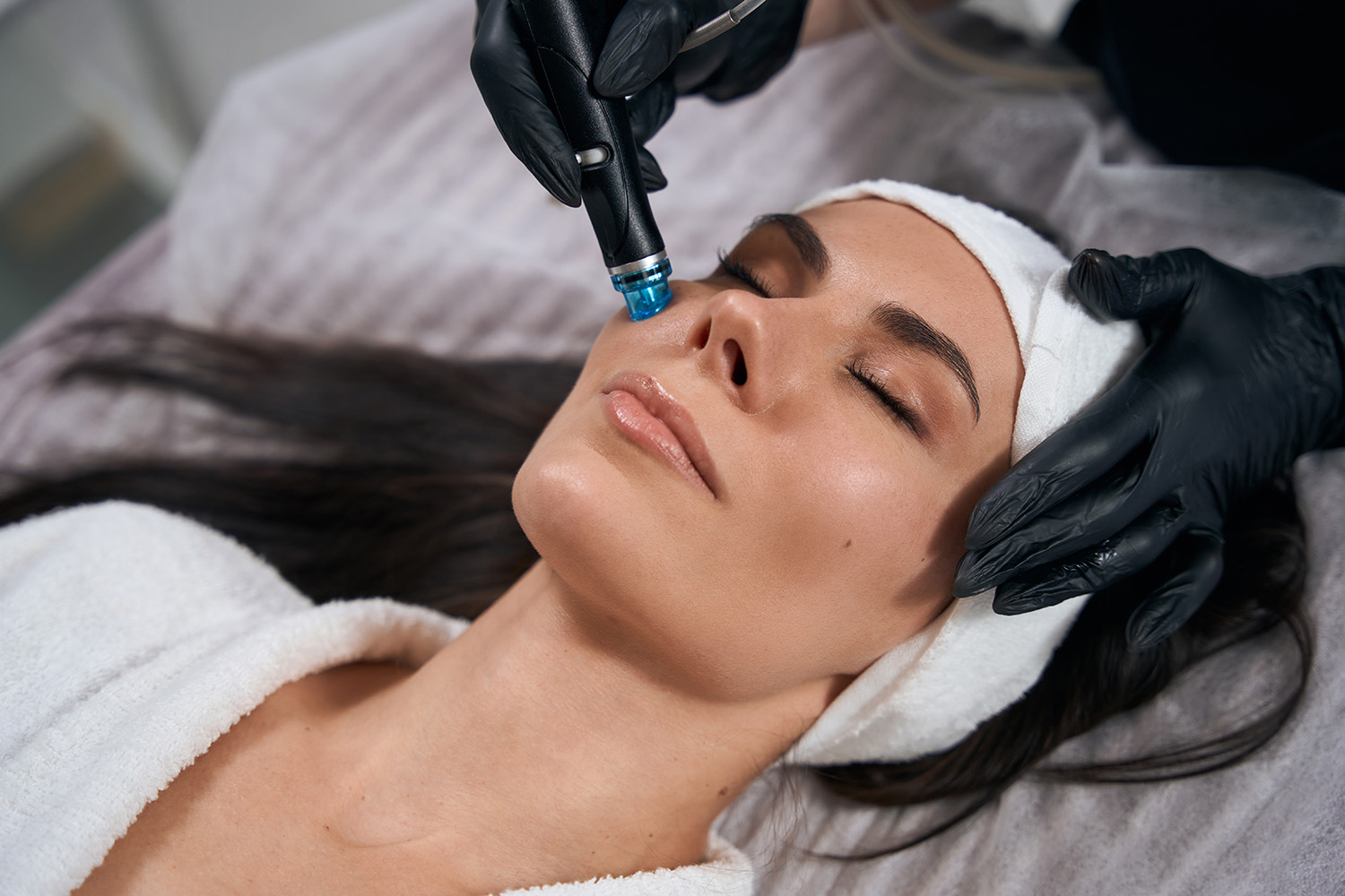 Beautician doing facial skin rejuvenation